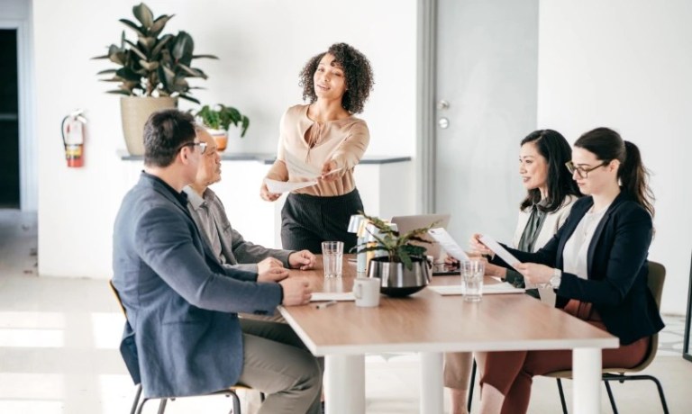 Professional Service workers in meeting with glass of water and coffee