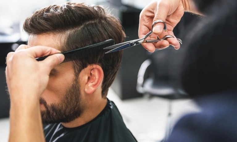 Man getting his haircut at salon