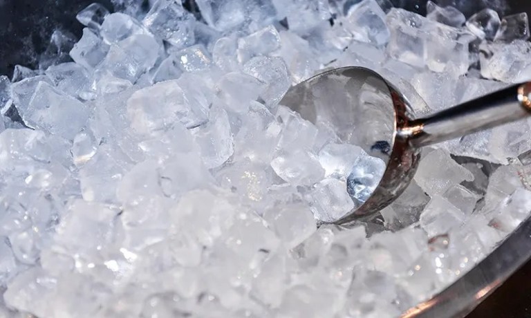 ice cubes in a pile with scooper